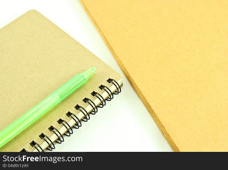 Notebook and envelope on white background