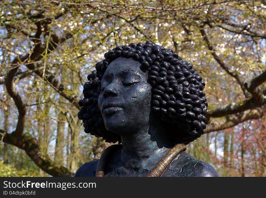 Bronze of a Afro-american head sculpture. Bronze of a Afro-american head sculpture.