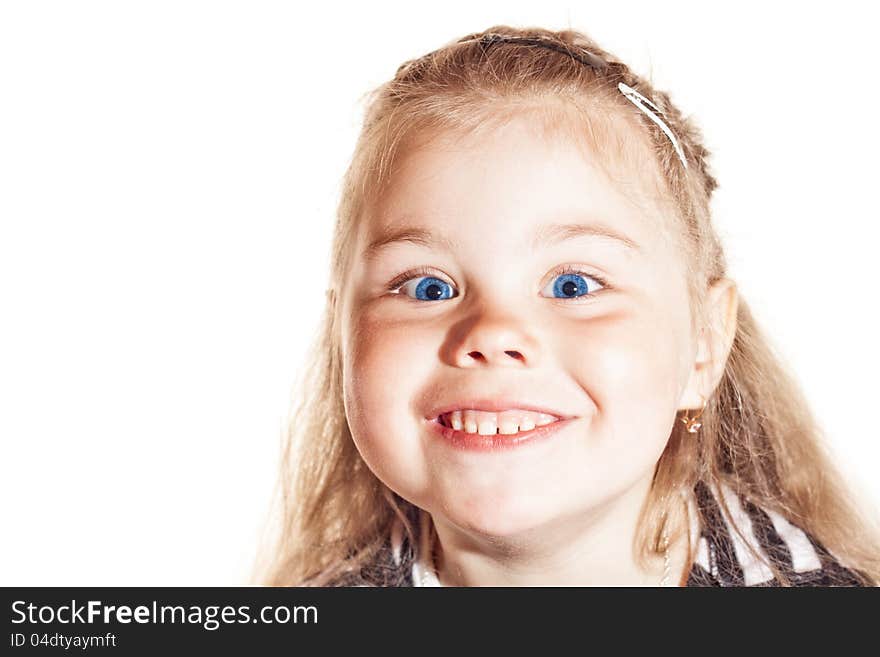 Funny smiling little girl with blue eyes