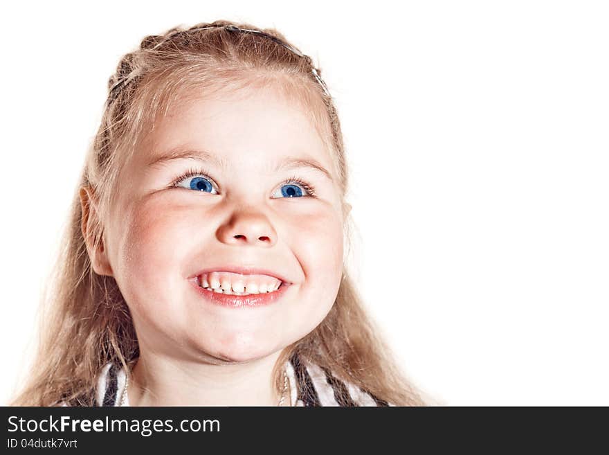 Funny smiling little girl with blue eyes