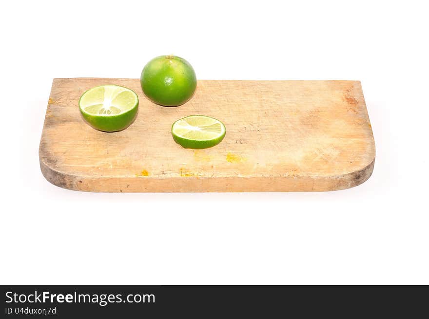 Limes Slice On Wooden Block Isolated On White