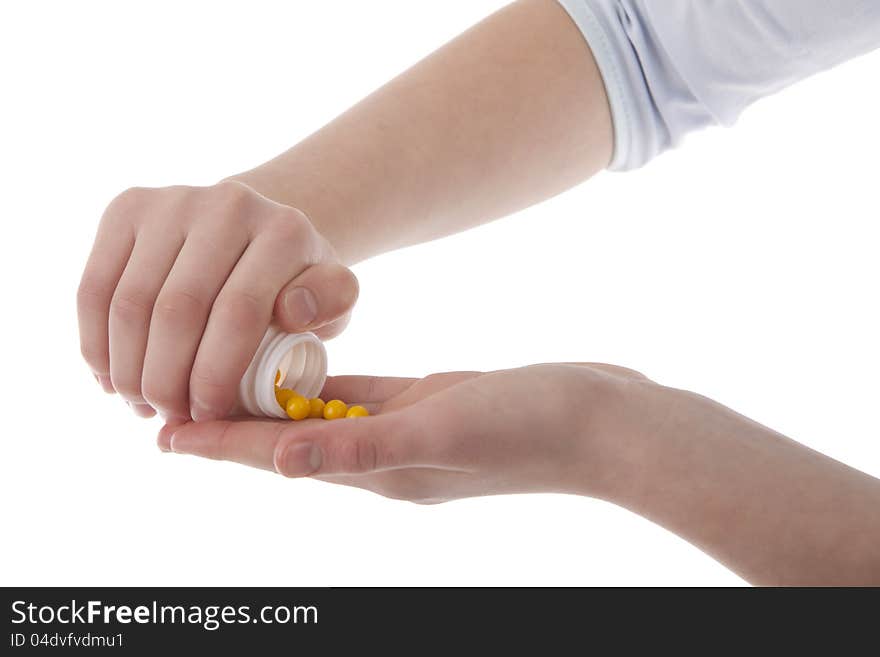 Image of a hands holding vitamins on white