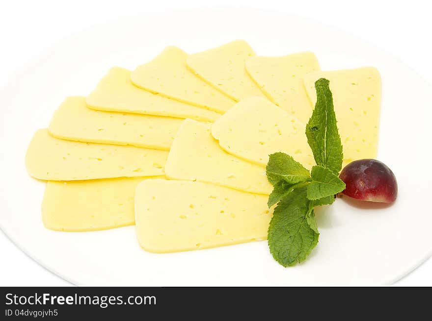 Cheese on a white background decorated with mint and radish