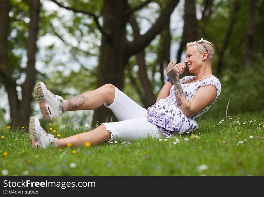 Beautiful woman has fun in the grass