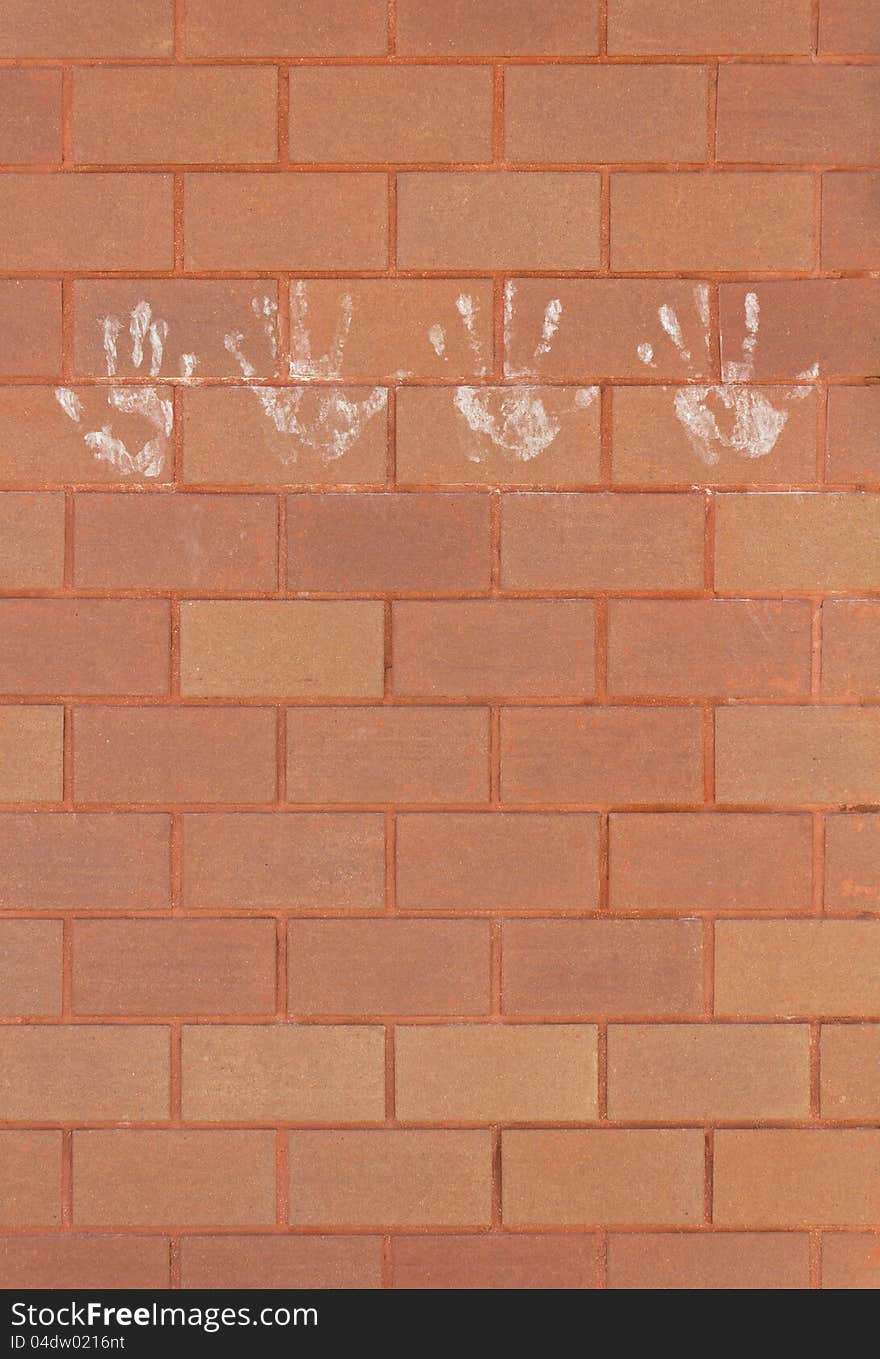 Hand Marks On The Brick Wall.