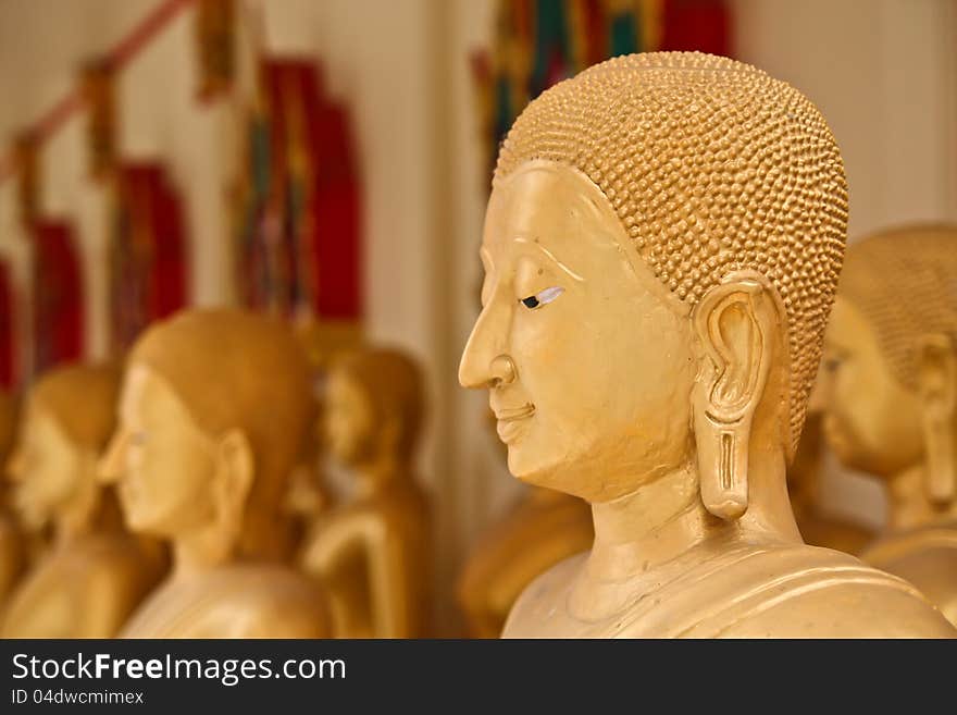 The golden face of buddha in the temple