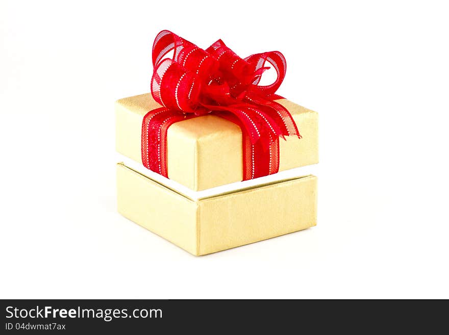 Gift box with red ribbon on white background