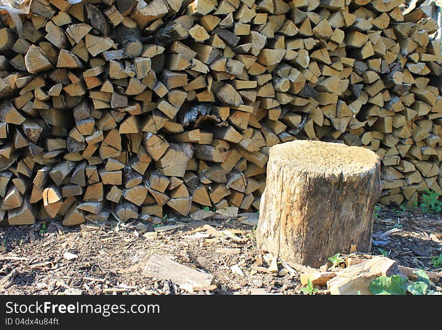 A lot of firewood against the blue sky