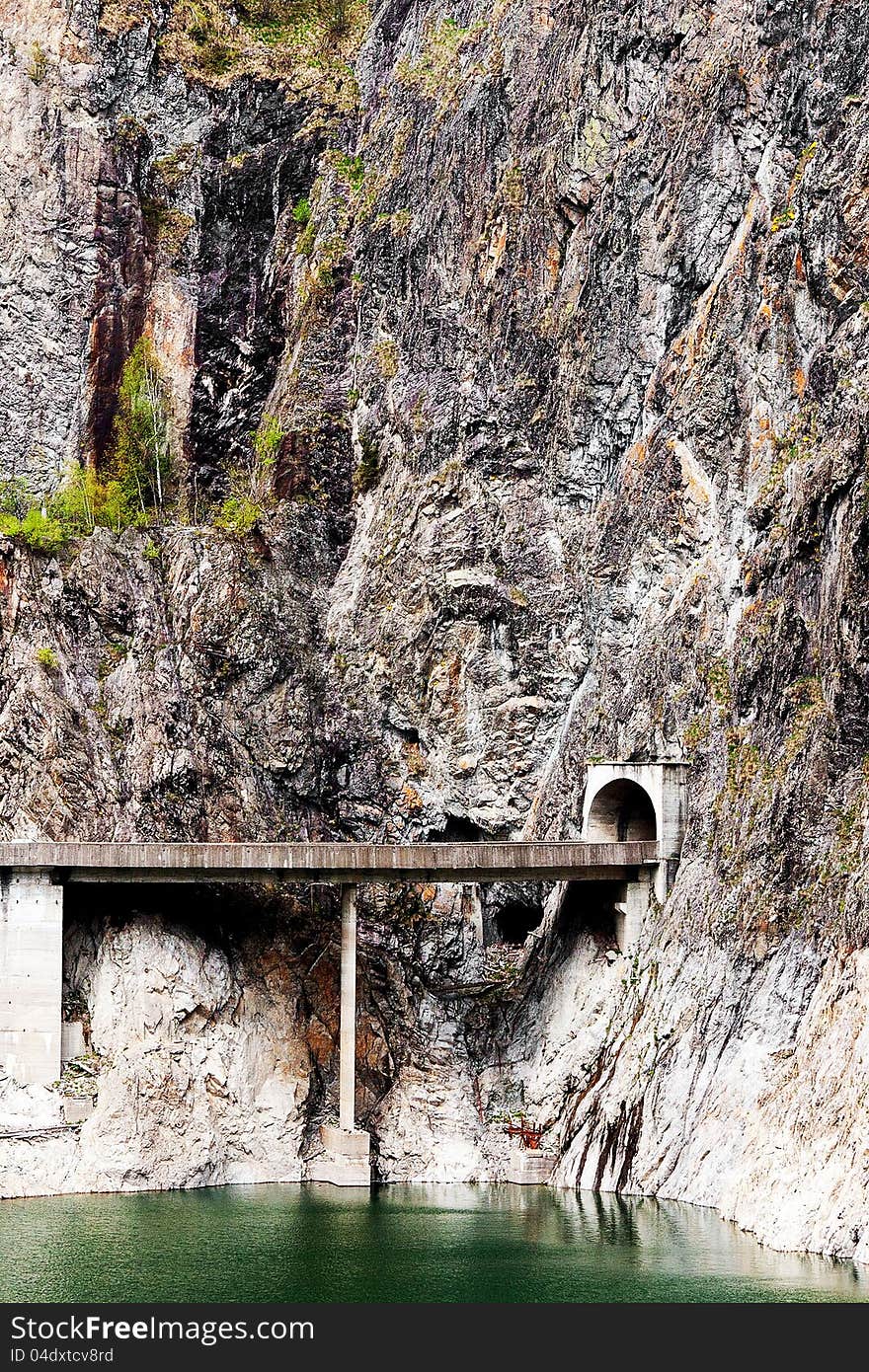 Tunnel dug by human power into the mountain, take on Dam Vidraru, Romania. Tunnel dug by human power into the mountain, take on Dam Vidraru, Romania