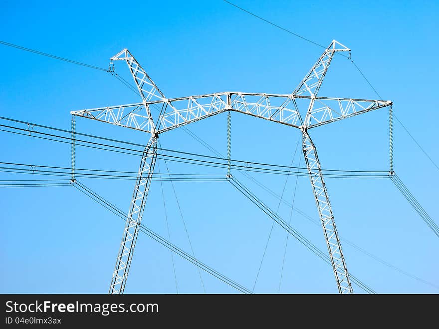 Electricity pylon against blue sky. Electricity pylon against blue sky