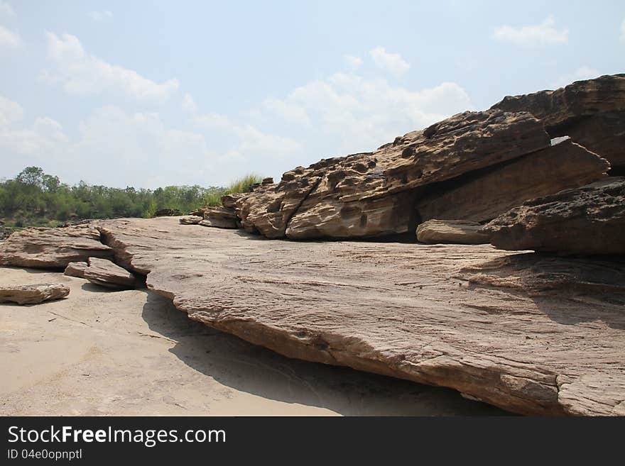 The traces of the river eroded the rock into a beautiful trail along the banks of the Mekong River between Thailand and Laos. The traces of the river eroded the rock into a beautiful trail along the banks of the Mekong River between Thailand and Laos.