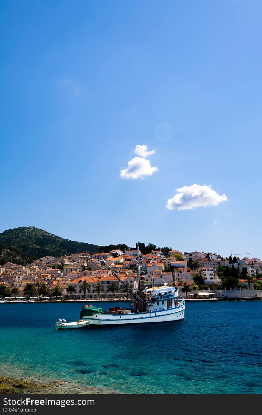 Boat on perfect blue waters. Boat on perfect blue waters