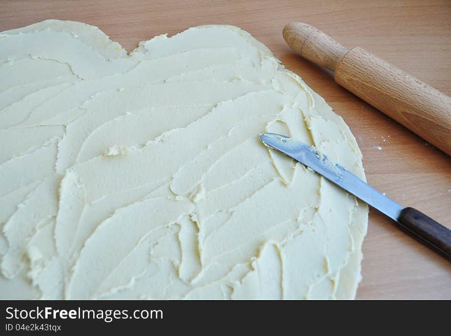 Dough for baking strudel with apple.