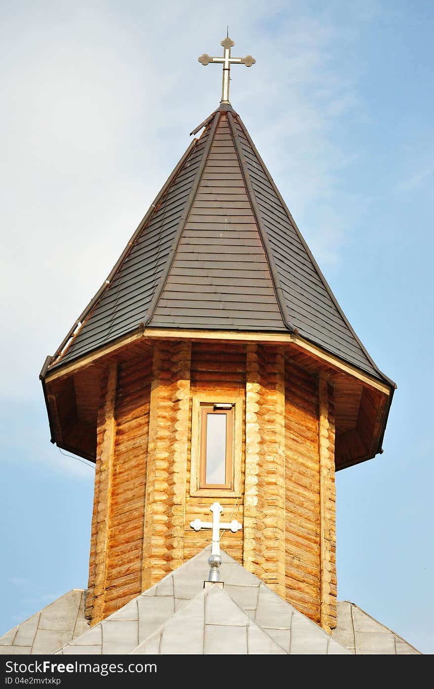 Photo of an church tower in the blue sky