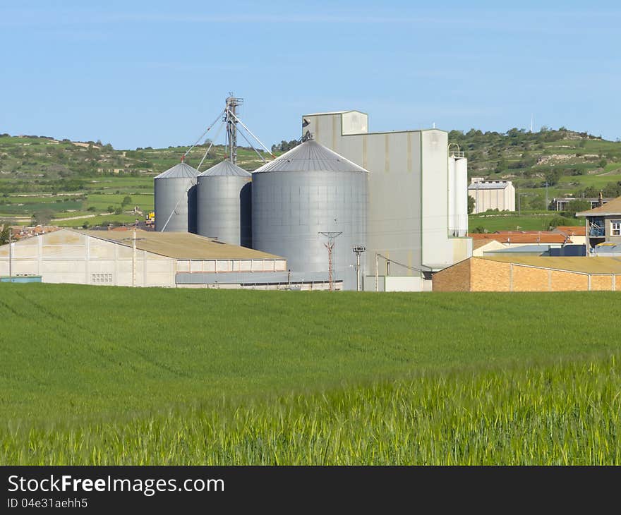 Agricultural farm with silos where wheat is stored in. Agricultural farm with silos where wheat is stored in