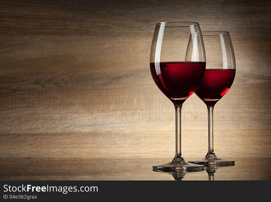 Two Wine glases on a wooden Background