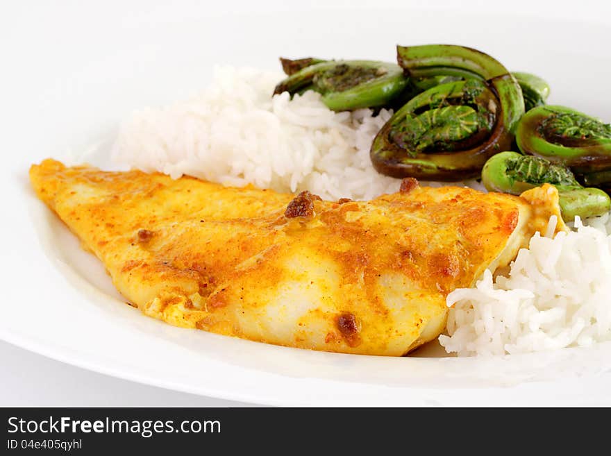 Honey mustard cod fillet served with basmati rice and grilled fiddlehead ferns. Honey mustard cod fillet served with basmati rice and grilled fiddlehead ferns