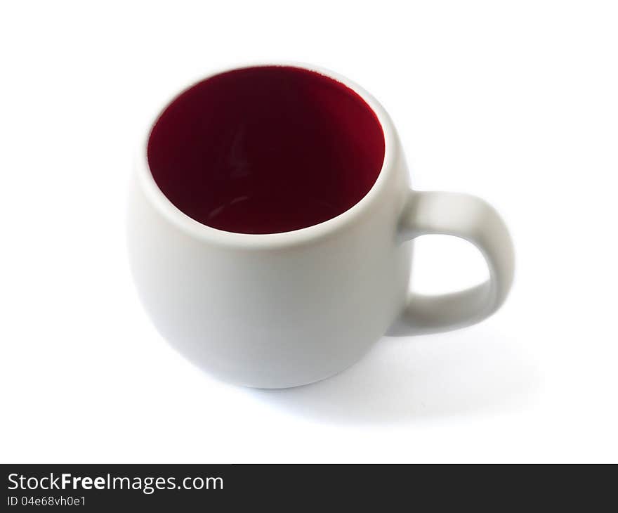 A white cup with red interior isolated on the white background