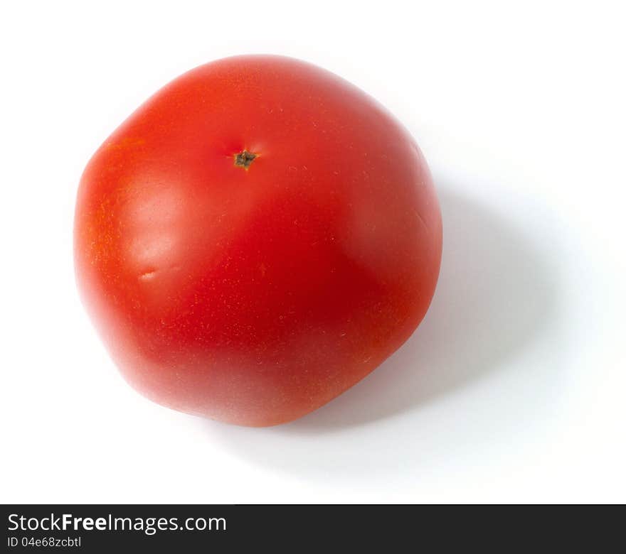 A close up shot of a tomato isolated on the white background