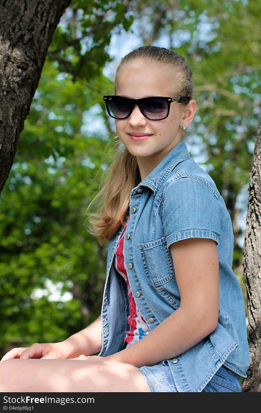 Portrait of a young beautiful girl in sunglasses. Portrait of a young beautiful girl in sunglasses