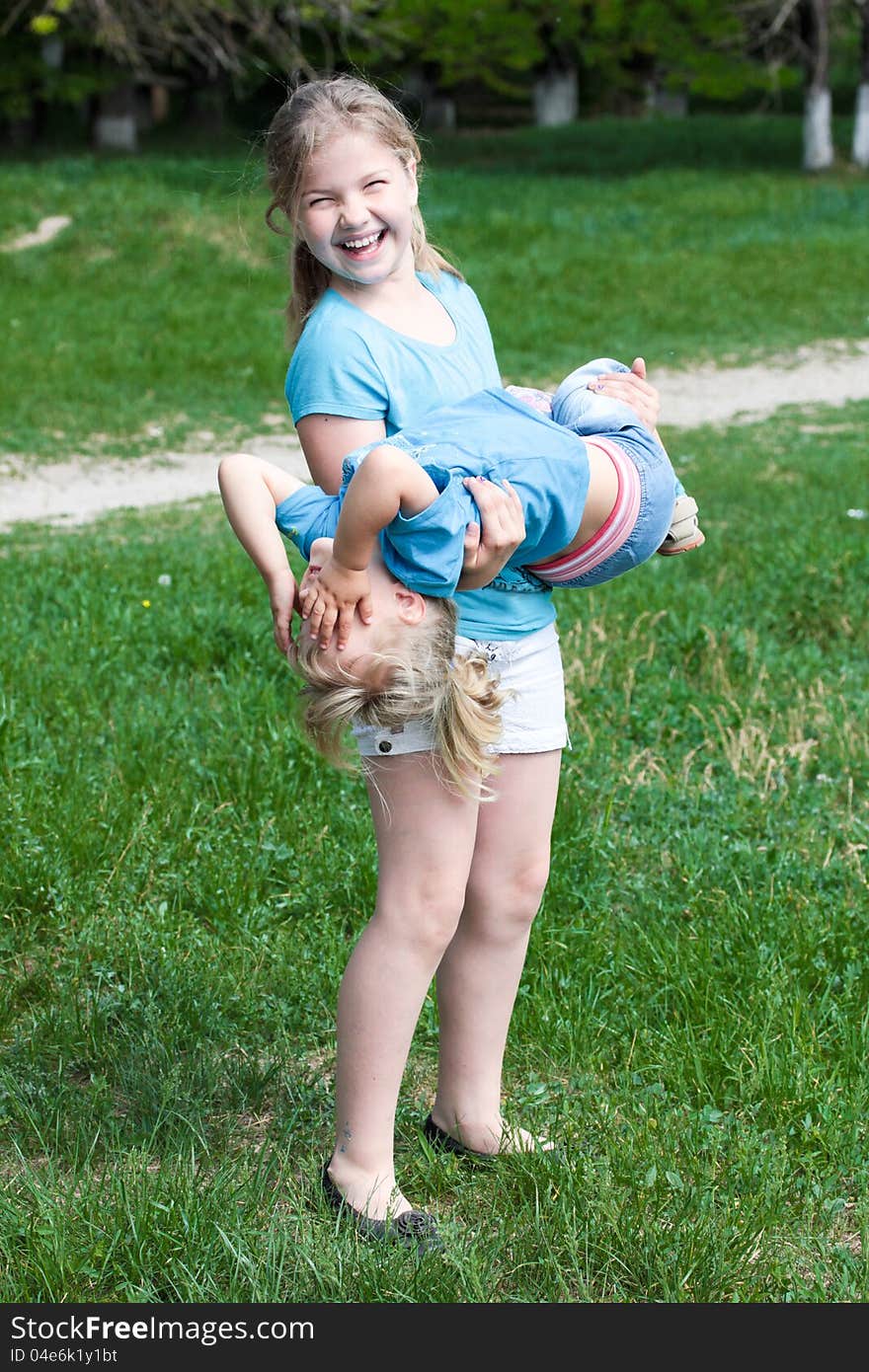 Two sisters indulge and have fun on a walk. Two sisters indulge and have fun on a walk