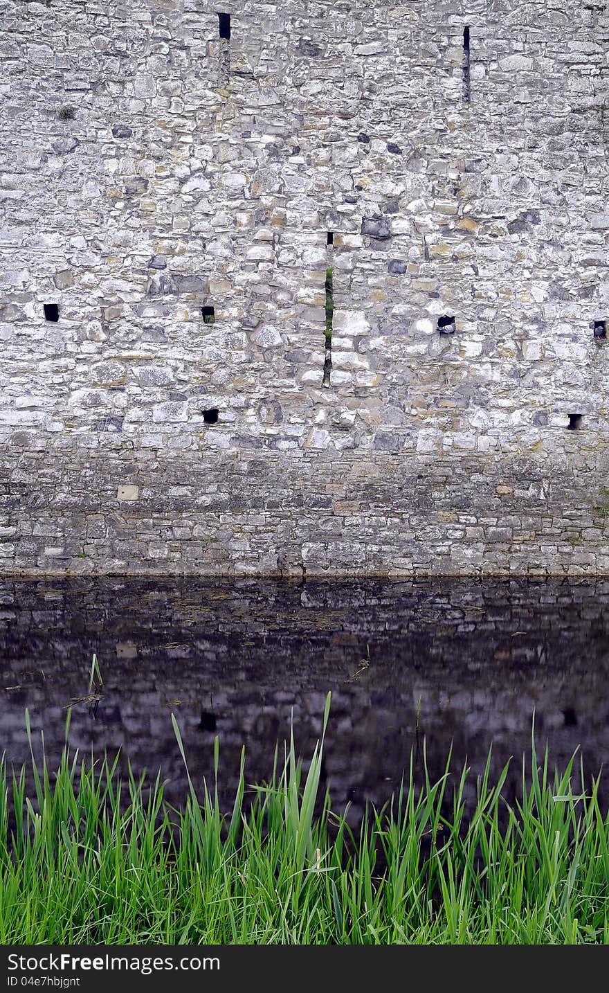 Trim castle wall and moat. The medieval irish kings castle at Trim, County Meath, Ireland. Spring season, early morning.