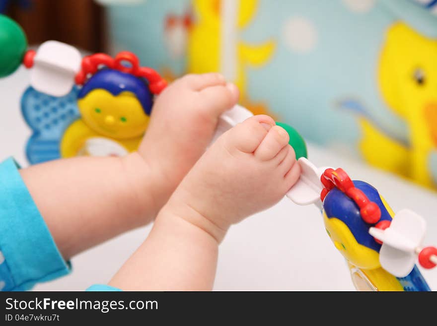 Baby feet in a bed