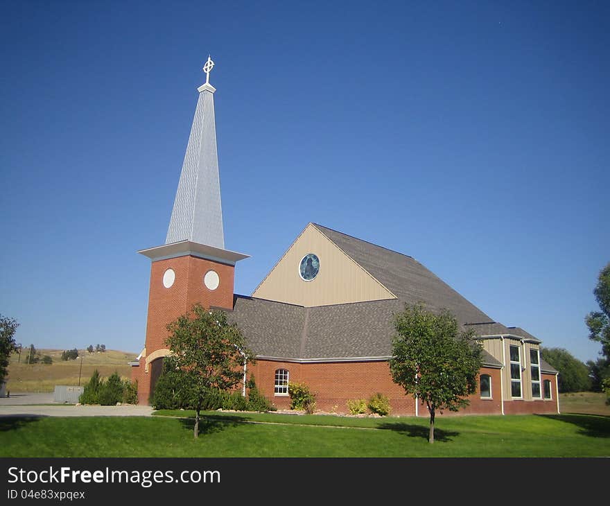 This is a picture of the New Holy Rosary church, Pine Ridge, South Dakota, home of the Ogallala Sioux Indian.

Symbols and materials important to the Native American culture were integrated as much as possible into the design of such things as the main altar, tabernacle, and stained glass windows.