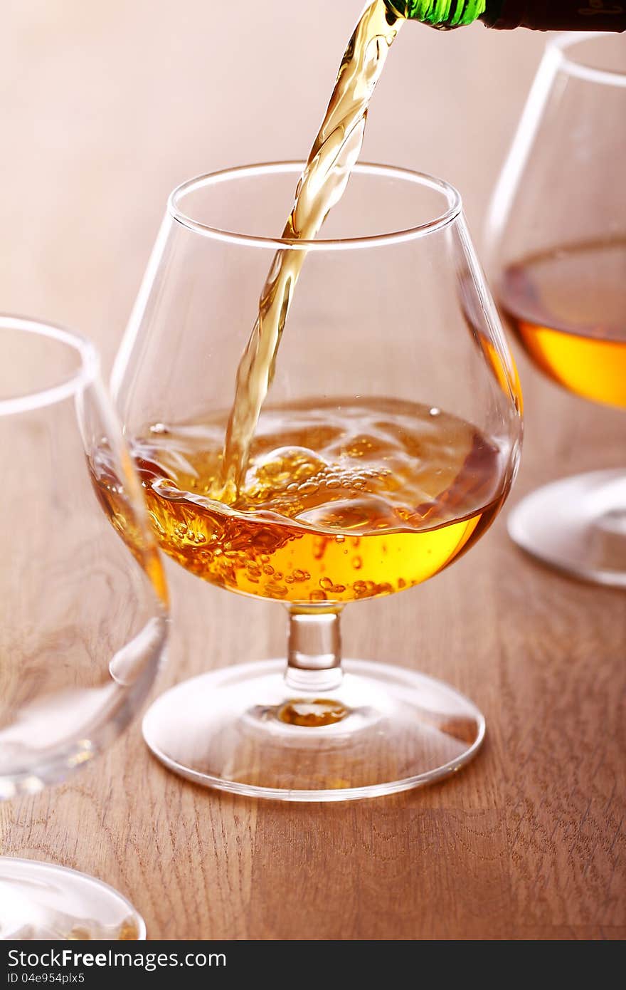 Pouring a cognac into the glass