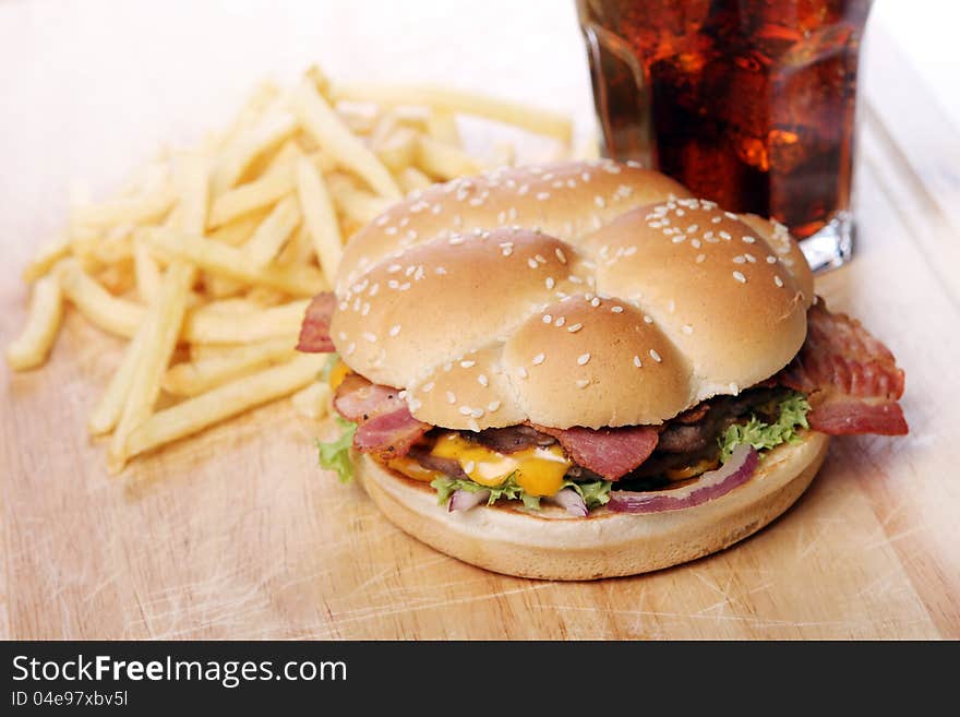 Big burger and chips on the table