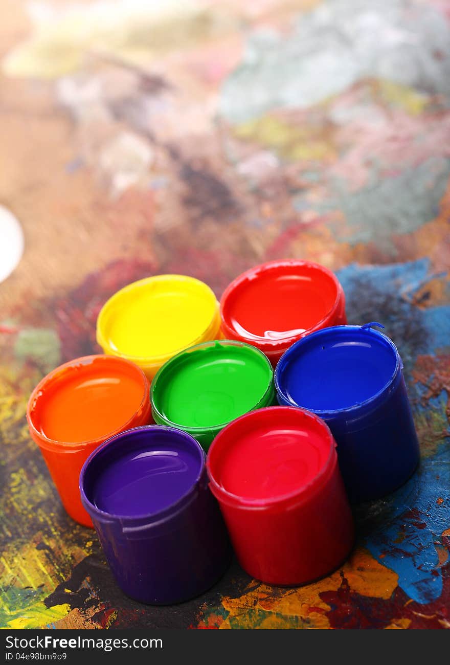 Close up of cans with colorful paint