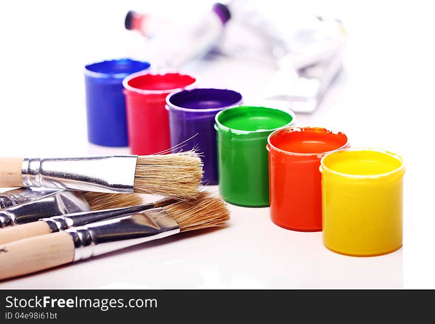 Close up of cans with colorful paint