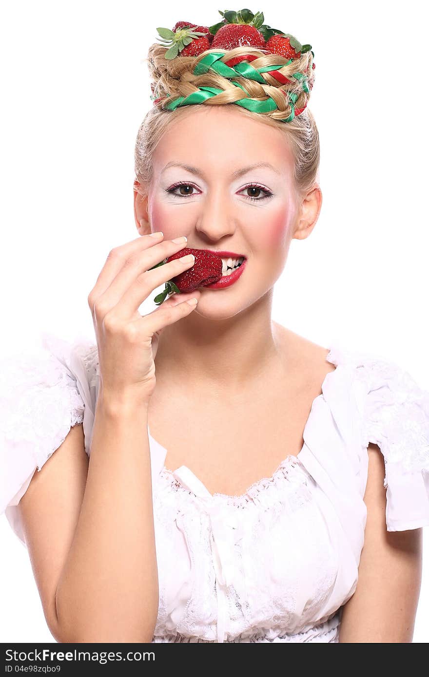 Woman with strawberry in her hairstyle over white background