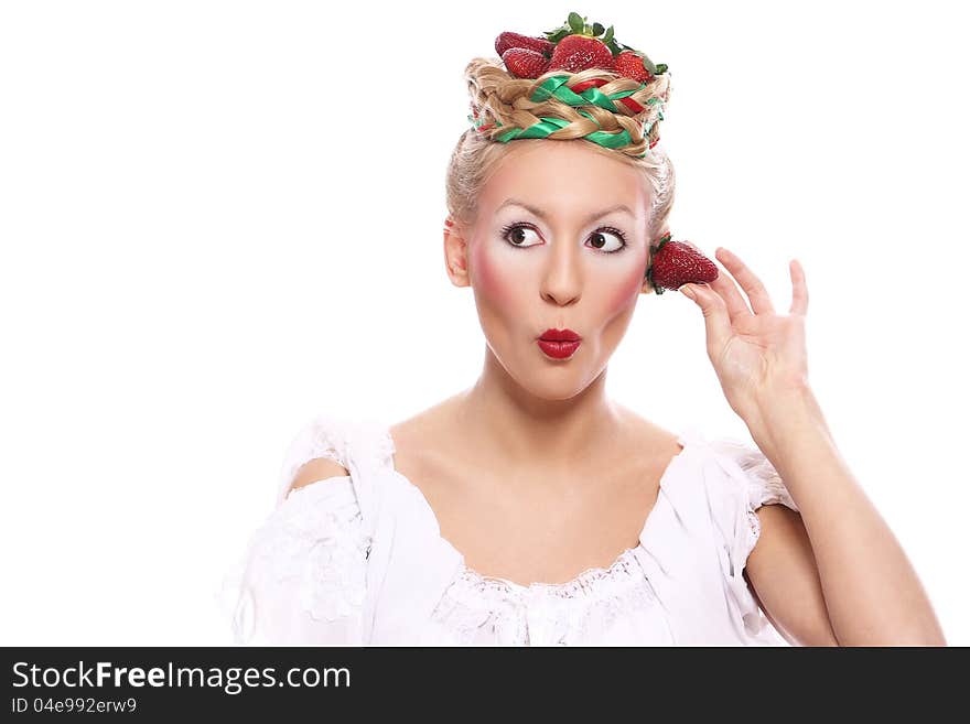 Woman with strawberry in her hairstyle over white background