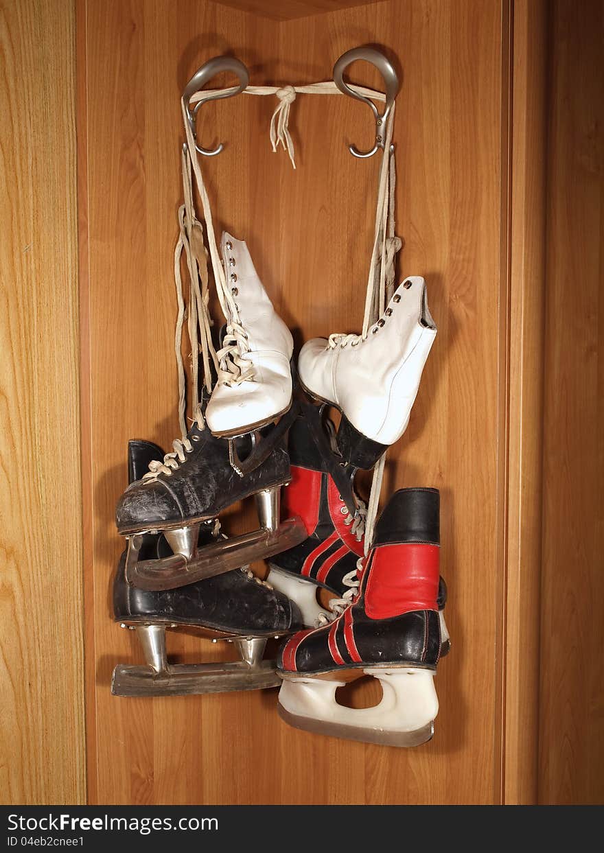 Three pairs of old skates