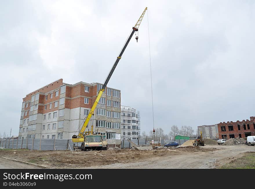 Big Crane on the background of the construction site, at home