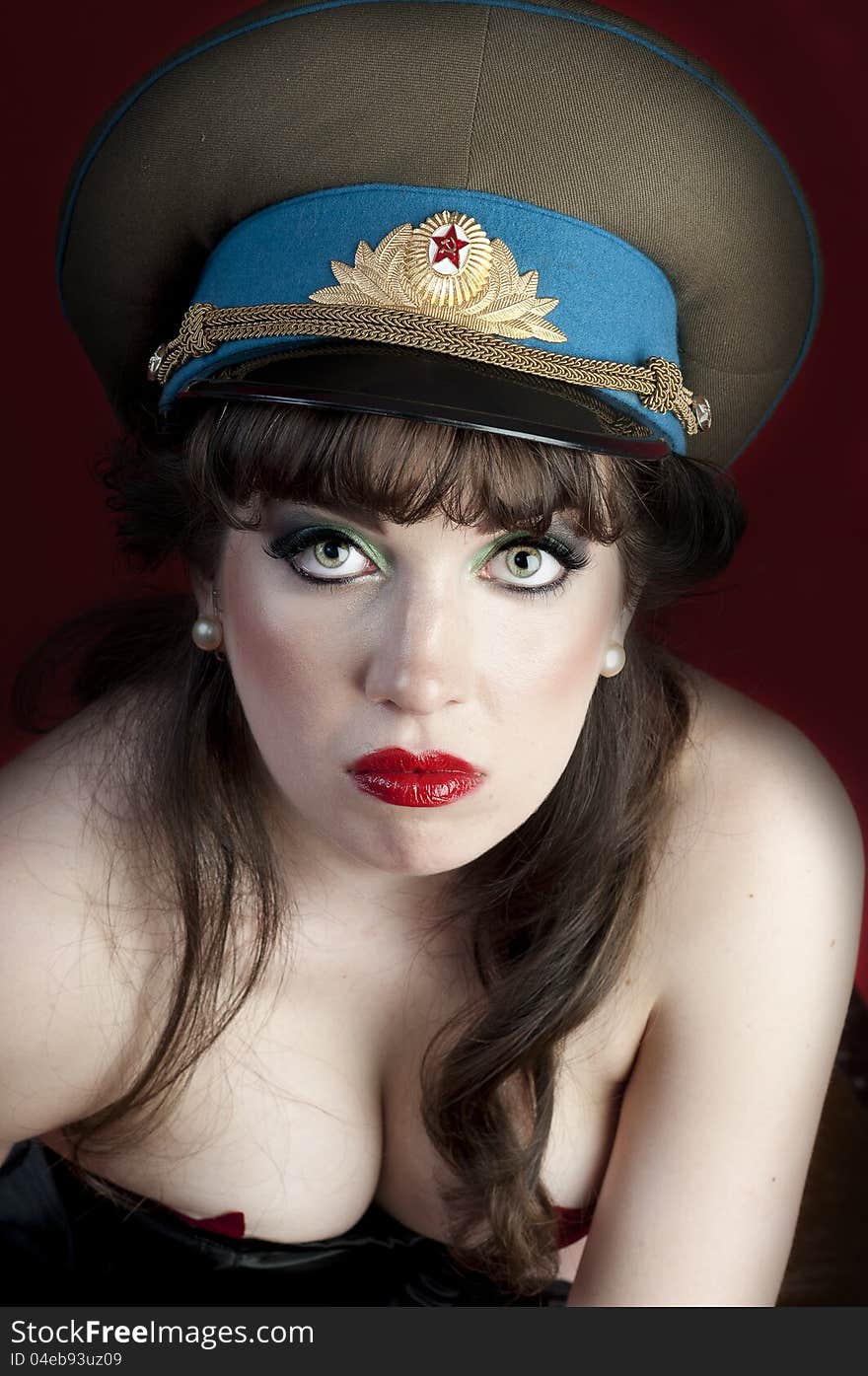 model wearing corset and military hat. model wearing corset and military hat