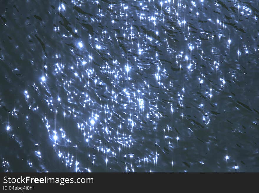 Blue water ripples with sunny sparks - abstract texture. Blue water ripples with sunny sparks - abstract texture