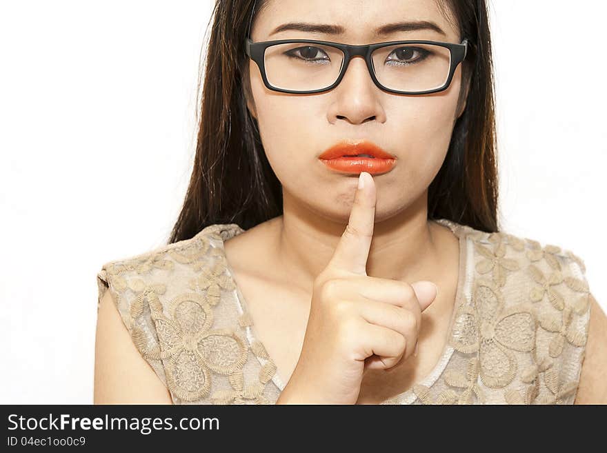 Woman with finger on lips you can feel she please be quiet