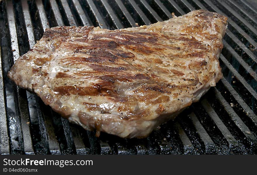 Steaks cooked on a grill in the restaurant