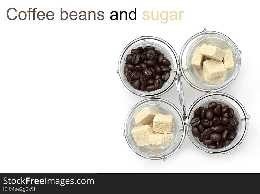 Coffee beans and sugar in glass