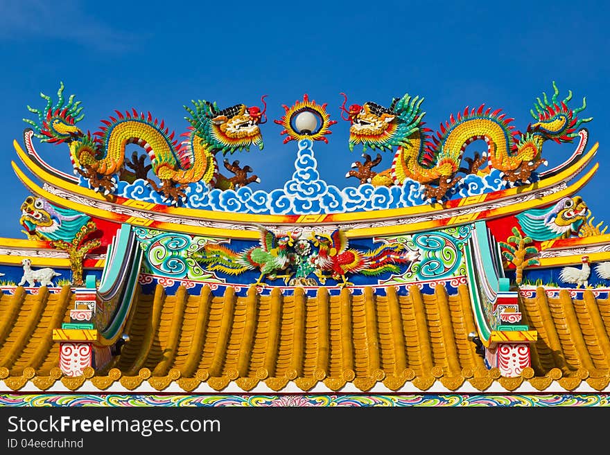 Chinese style dragon statue on blue sky