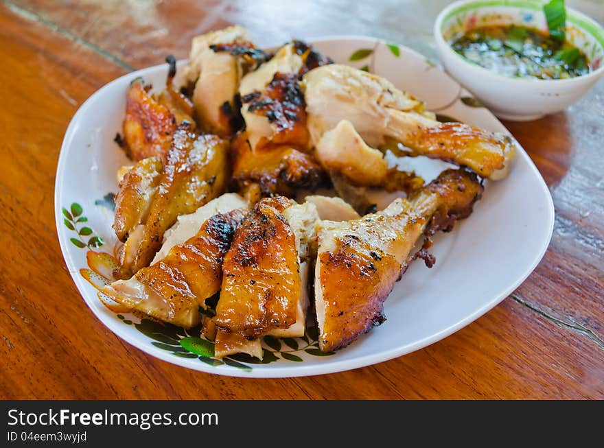 Grilled chicken on table