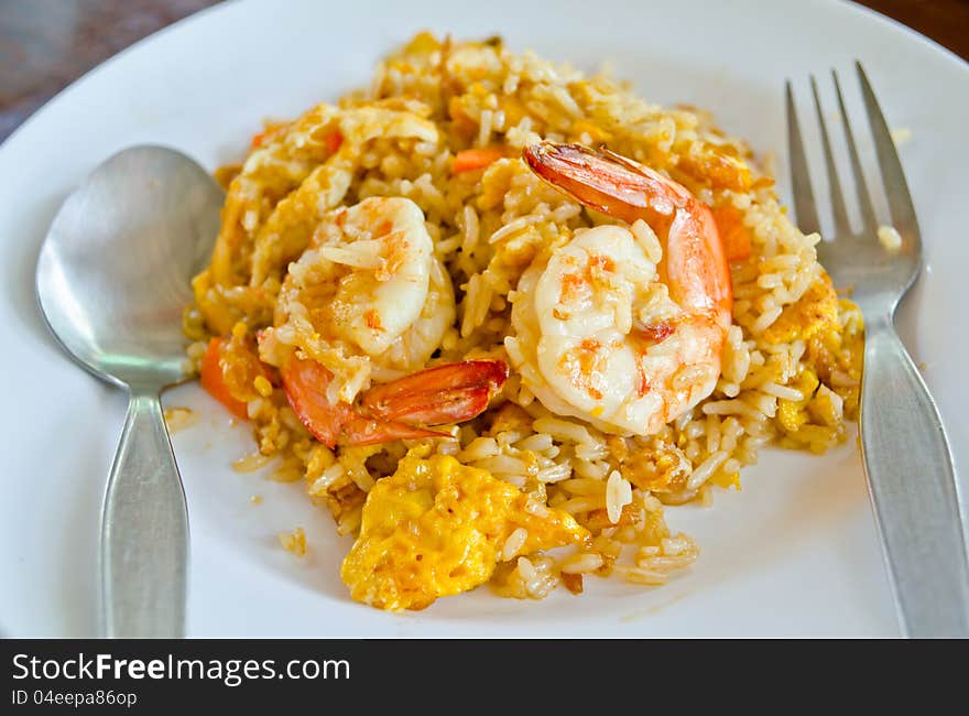 Close up fried rice with shrimp on white dish