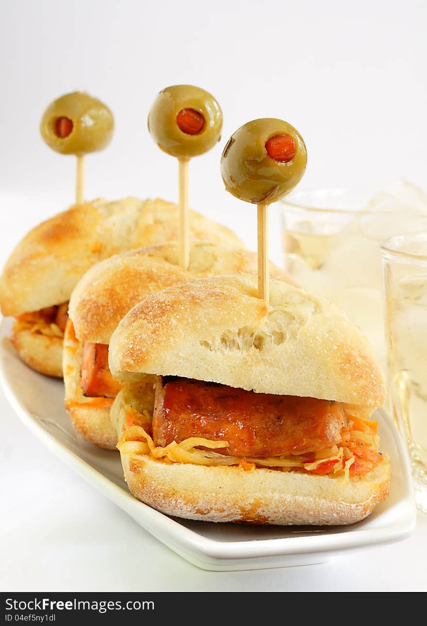 Spicy italian sausage layered on coleslaw in a ciabatti bread roll. Spicy italian sausage layered on coleslaw in a ciabatti bread roll