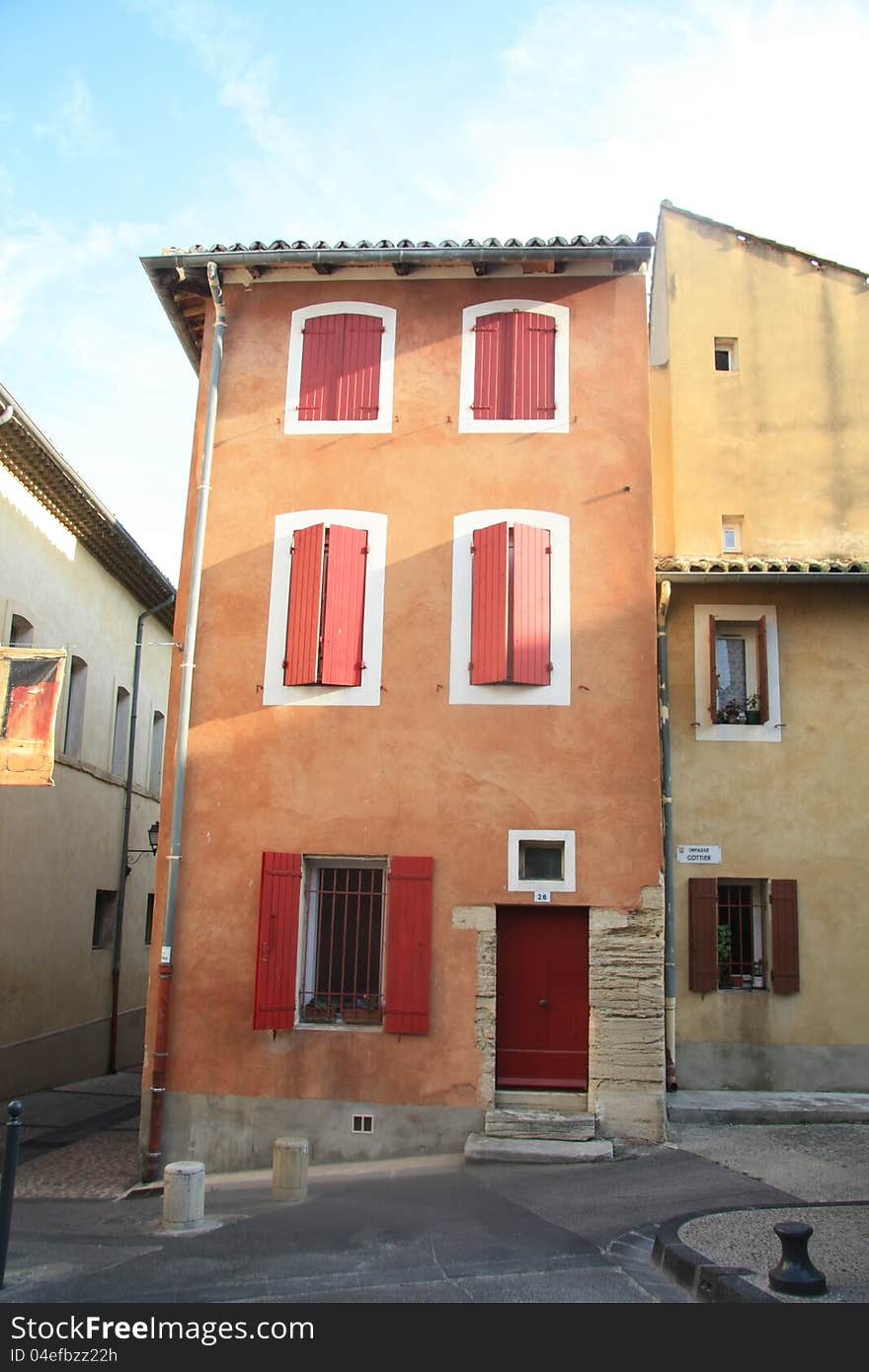 House in typical provencal style in France, windows with wooden shutters. House in typical provencal style in France, windows with wooden shutters