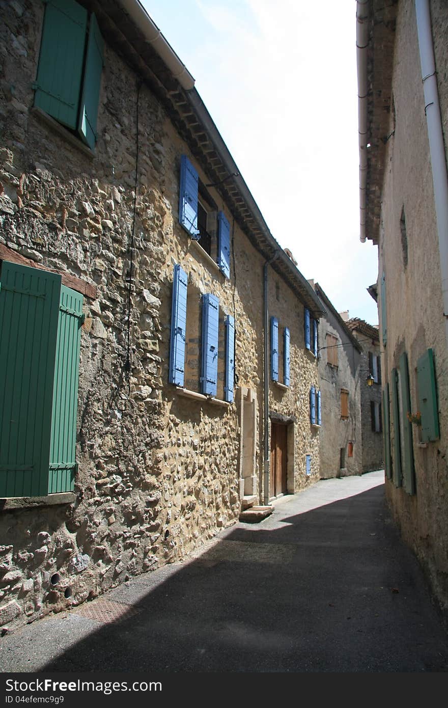 Narrow street in a small village in the Provence, France. Narrow street in a small village in the Provence, France