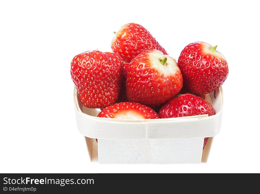 Strawberries in a wooden basket. On a white background. Strawberries in a wooden basket. On a white background.