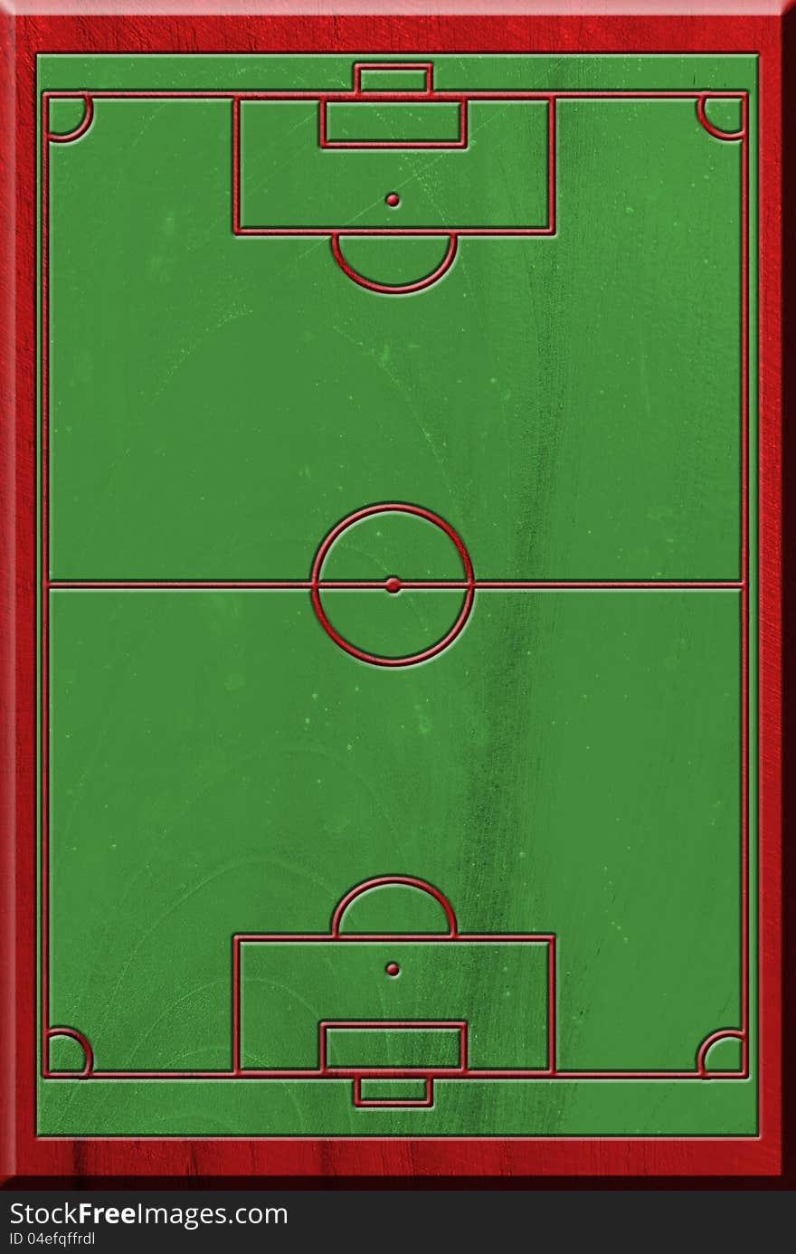 Soccer field on wooden plate