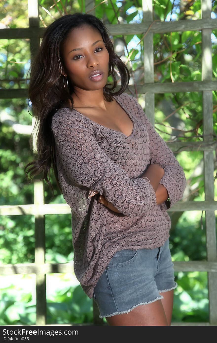 Beautiful African American woman in the garden. Beautiful African American woman in the garden.